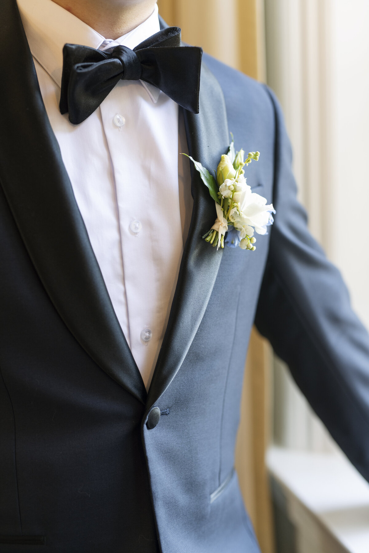 modern delicate romantic white and blue groom wedding boutonniere