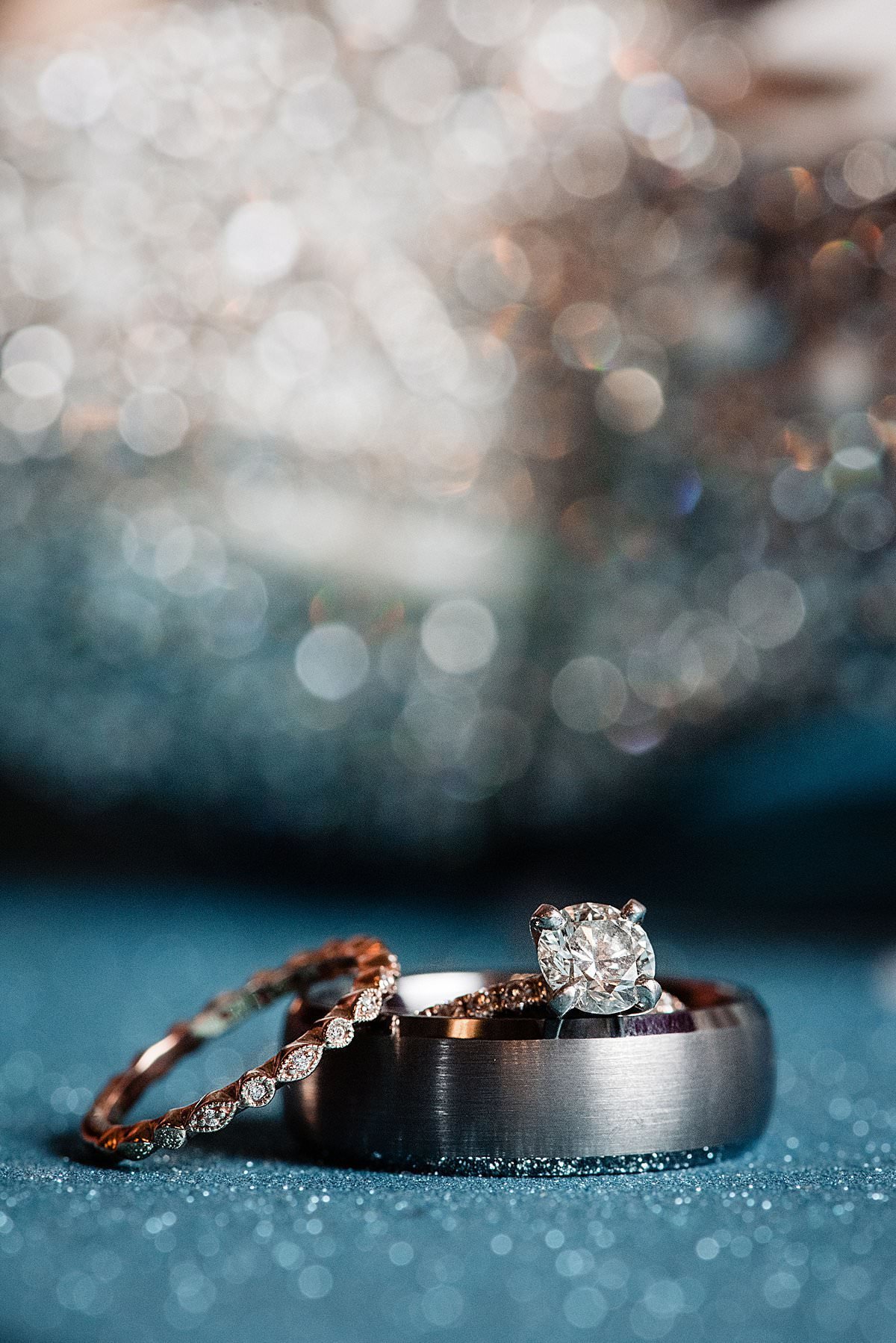 Engagement ring and wedding hand with grooms band