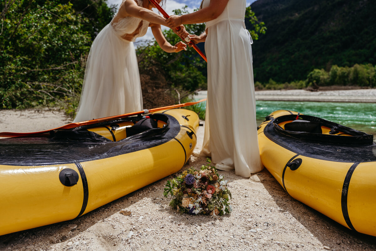 Brides paddling Soča Valley river elopement