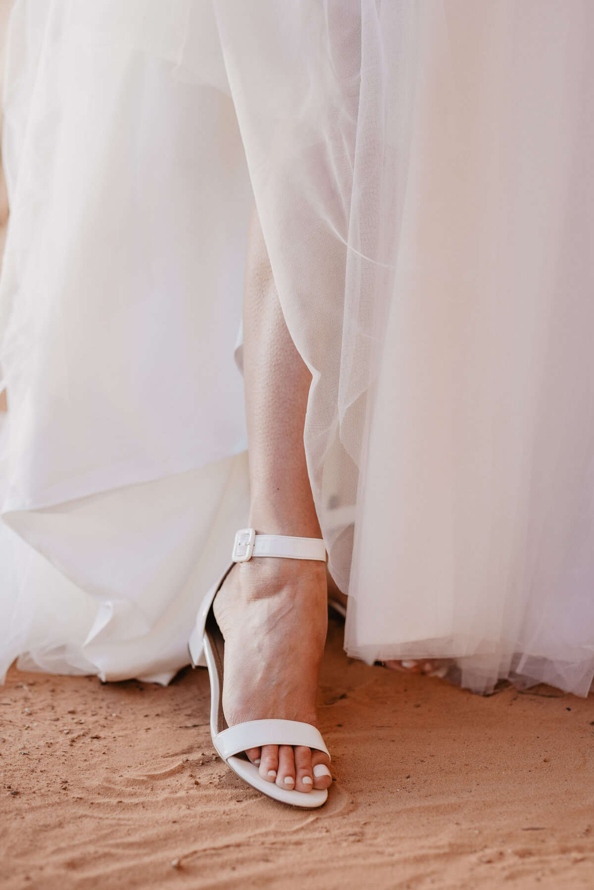 Utah elopement photographer captures bridal shoes on Arches National Park wedding day