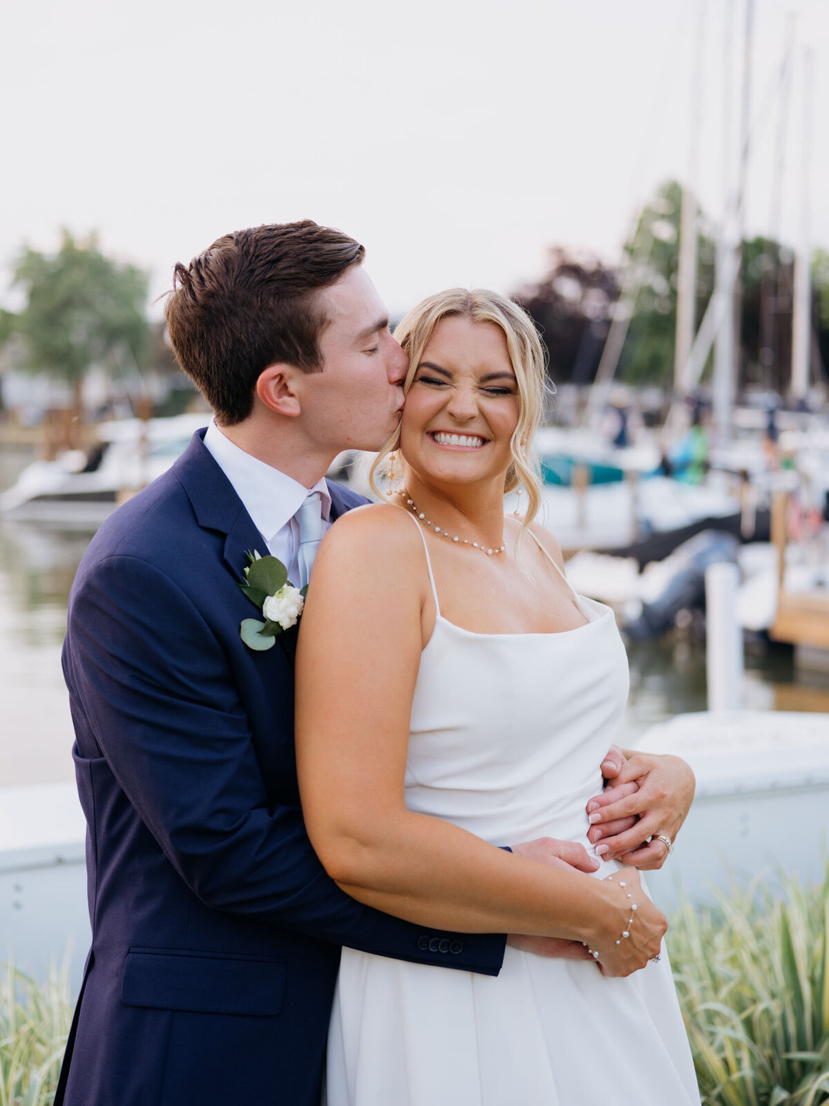 Bride and groom sunset portriat by the dock at Cleveland Yachting Club