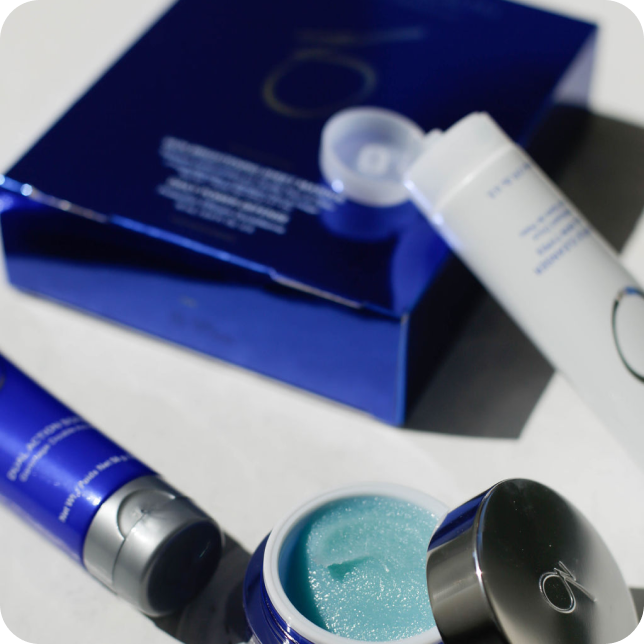 Metallic blue skincare packaging beautifully captured during a photoshoot for their social media. 