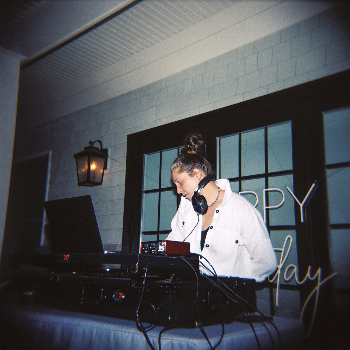 Photo of DJ Ashli on film in private backyard party by Mira Park Photography NY based wedding photographer