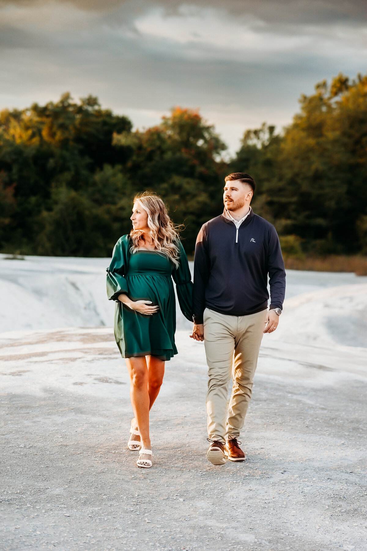 pregnant woman and husband walking on cliffs by lancaster pa maternity photographer