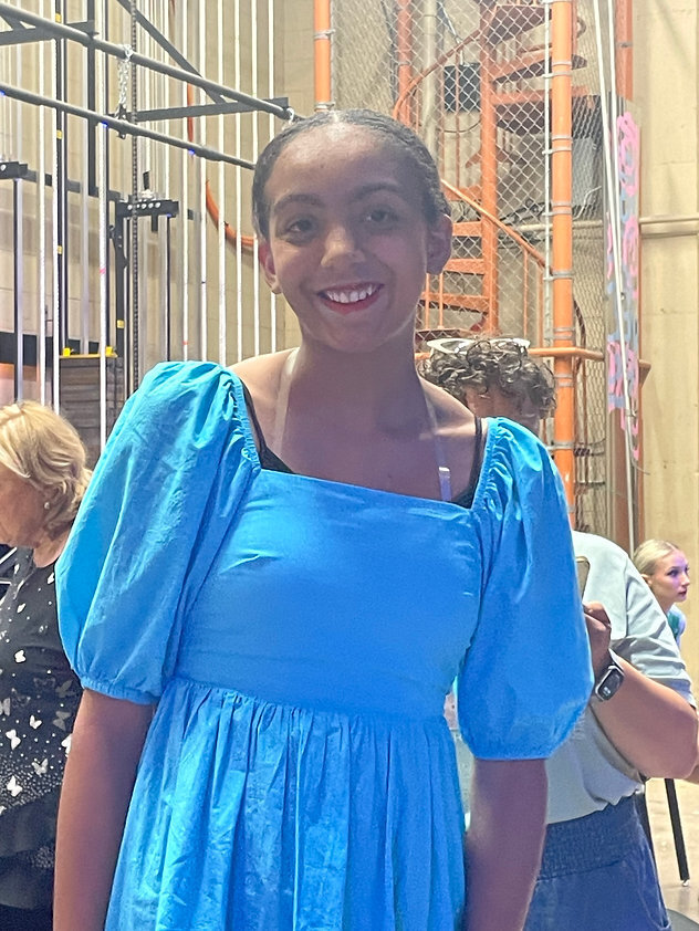 a middle schooler ready to walk across the stage at recital