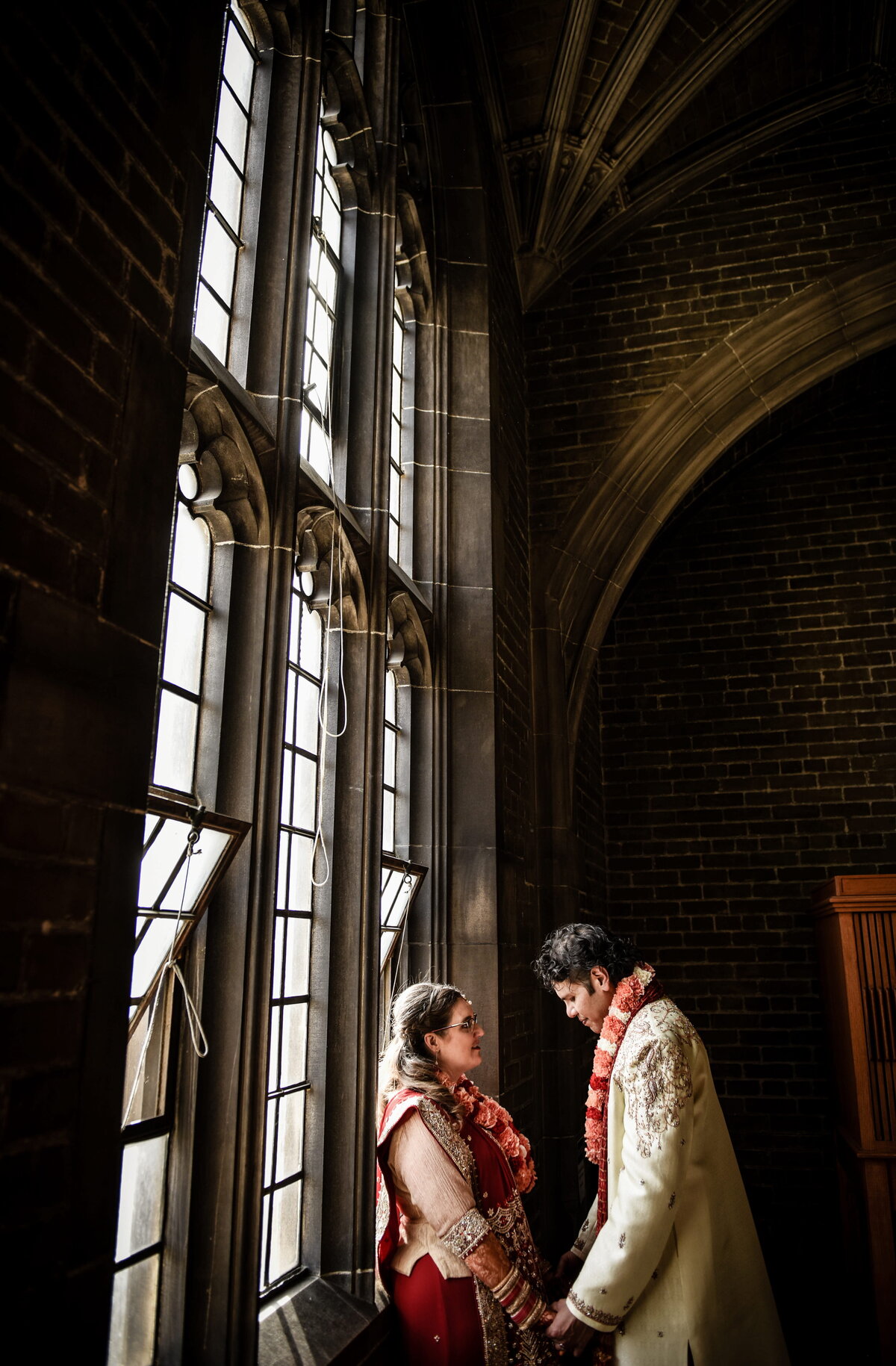 Wedding Couple Under Gothic Windows