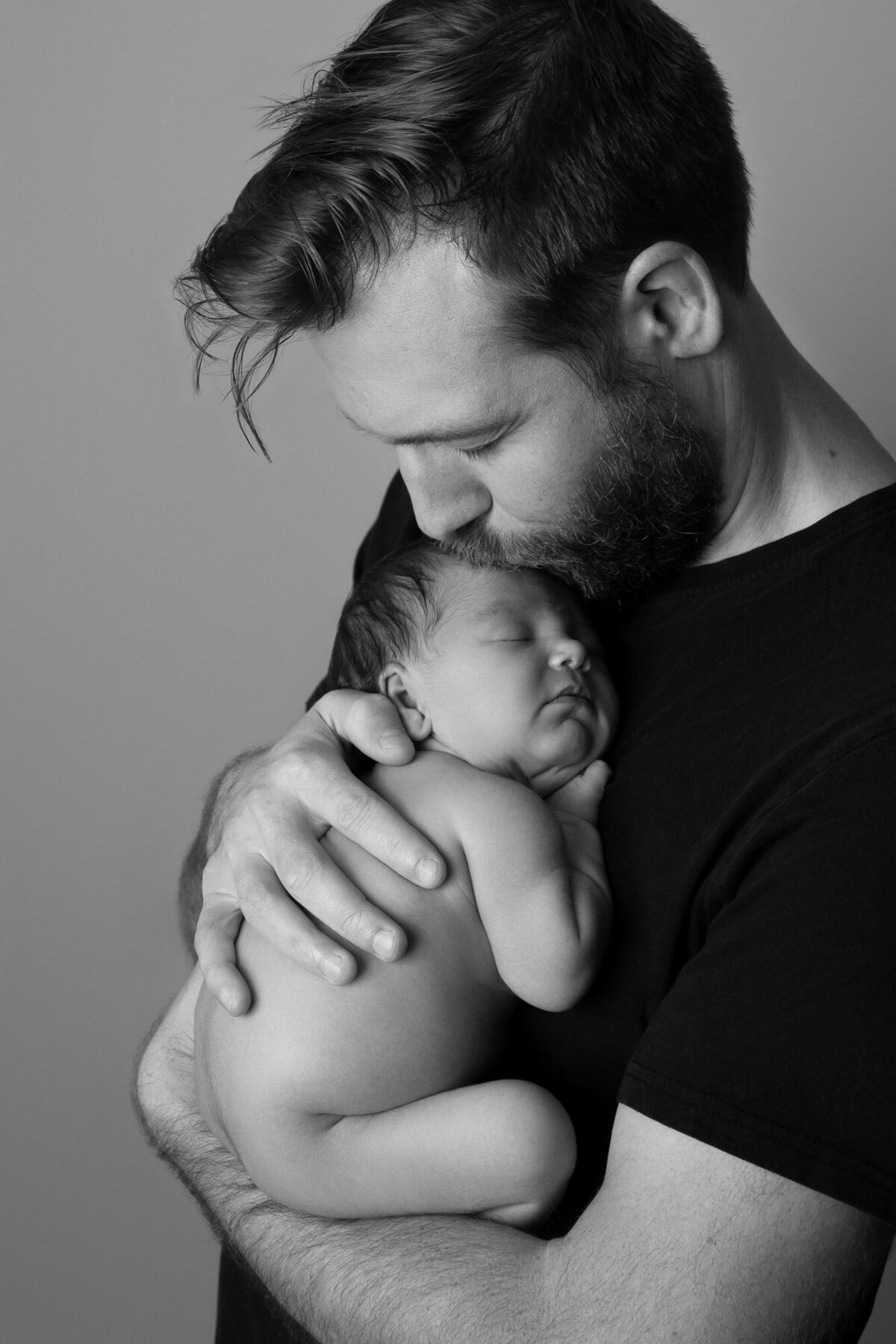 Father holding newborn black white portrait Spanish Oaks family photographer
