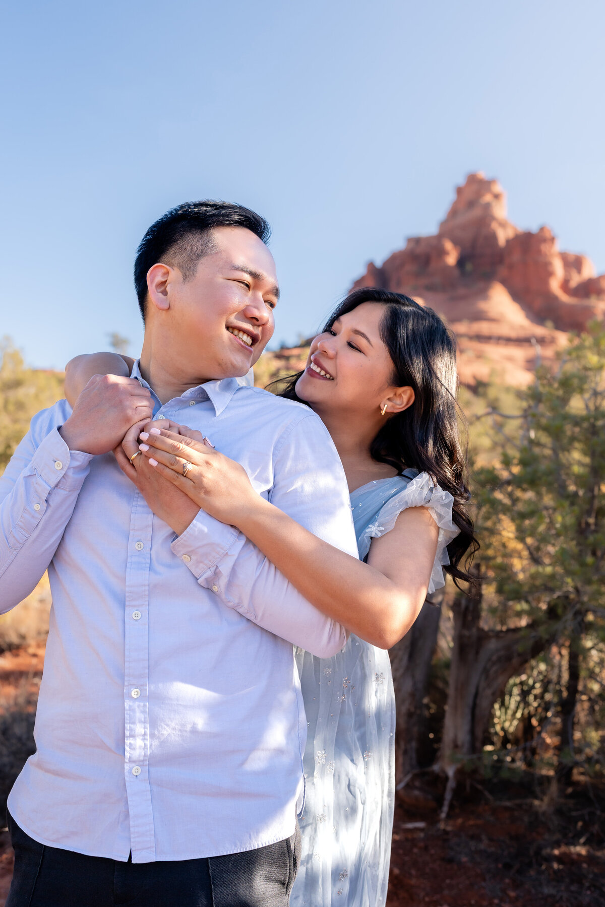 Bell Rock Sedona Arizona Elopement with Asian couple embracing.