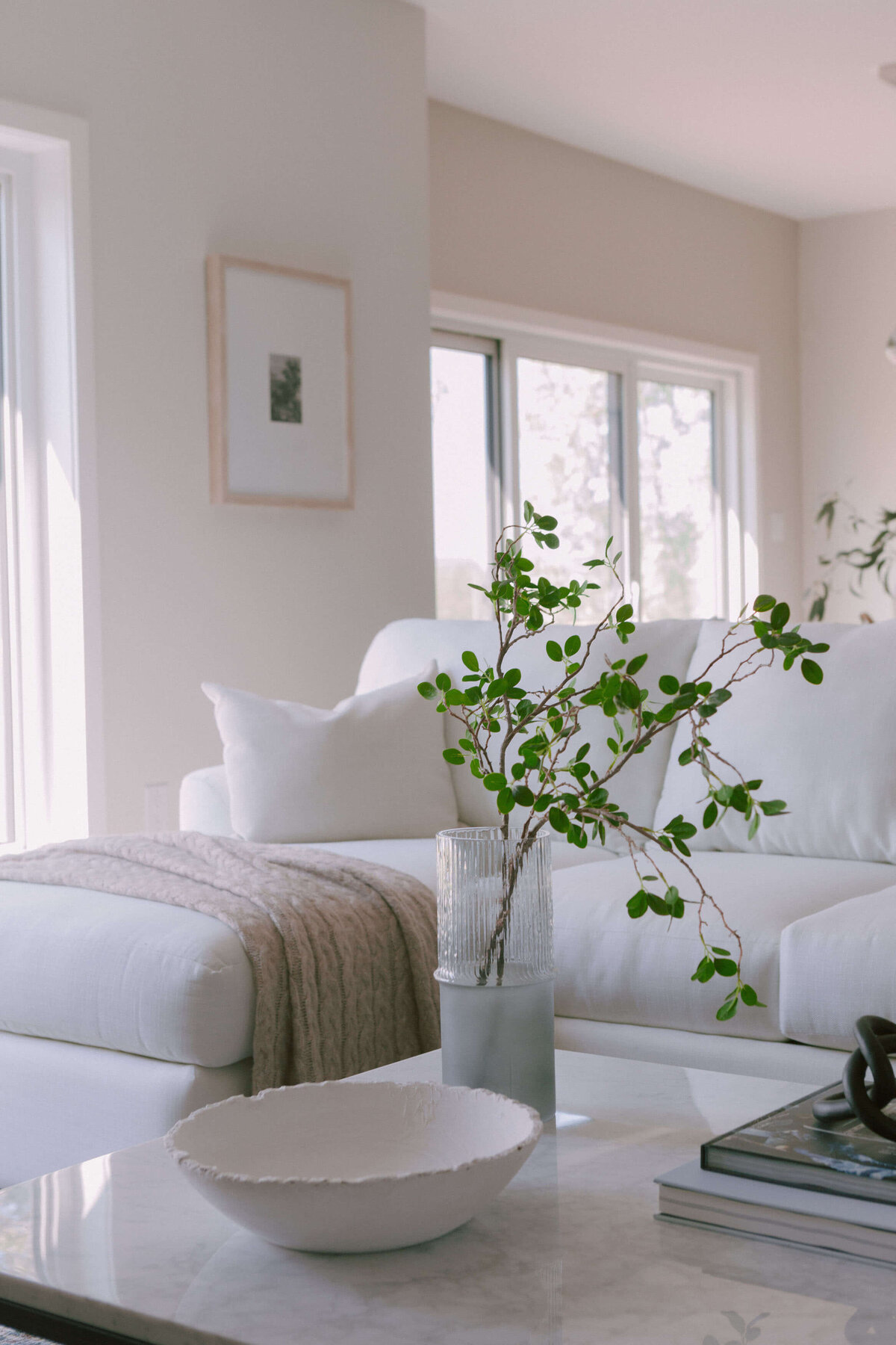staged marble coffee table in luxury living room with white sofa