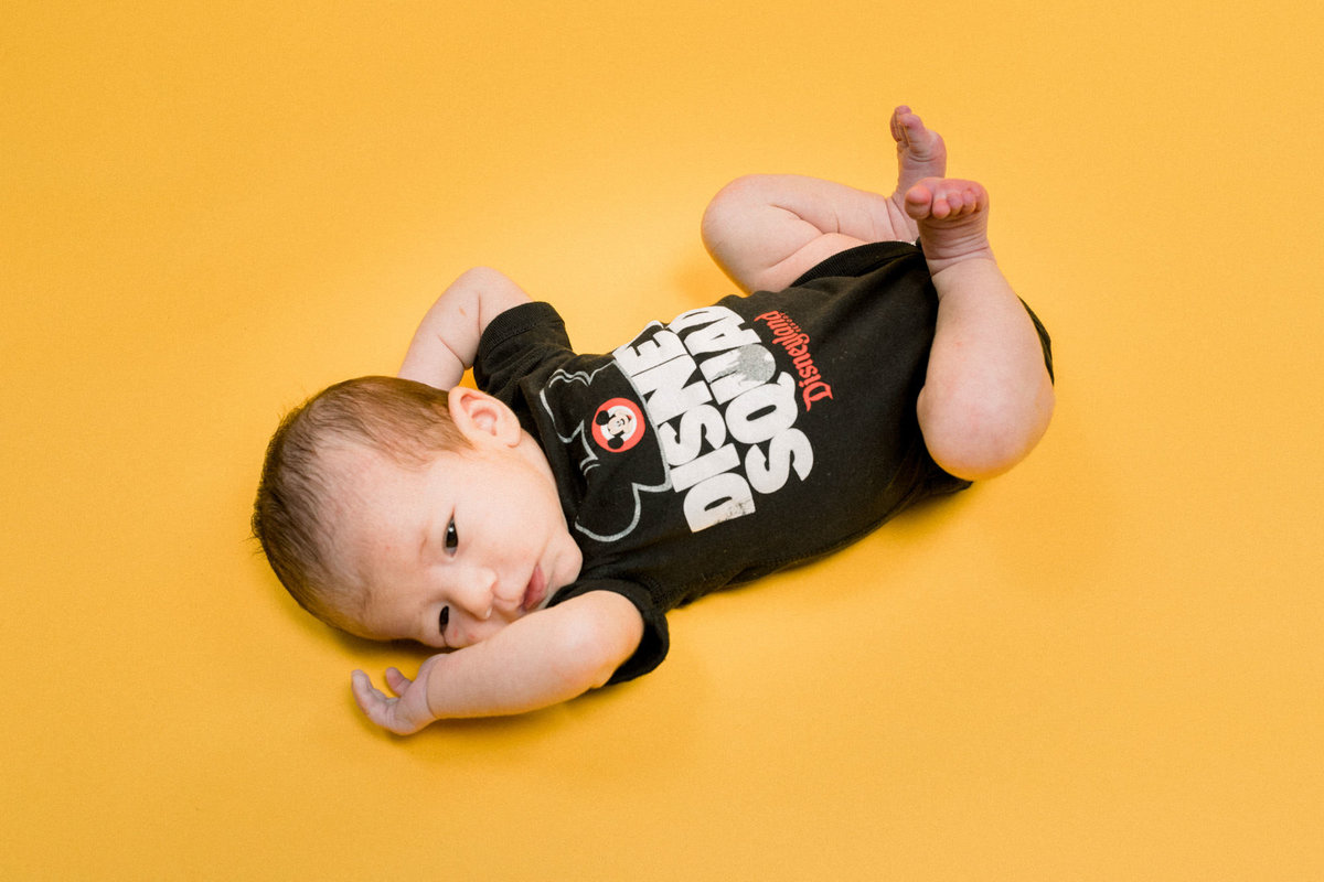 Baby lays down during photo shoot