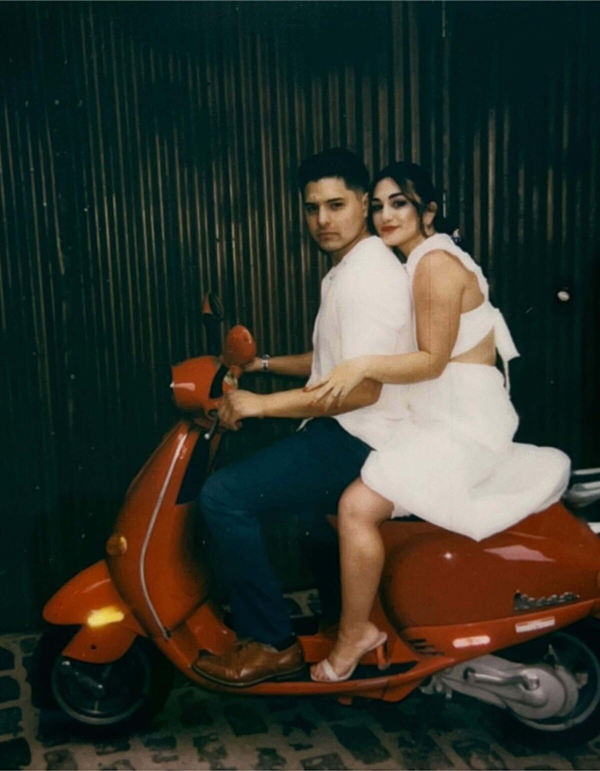 couple-on-red-vespa-polka-dot-wall-film-photo