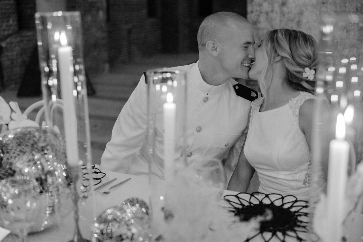 Couple Kissing at Table