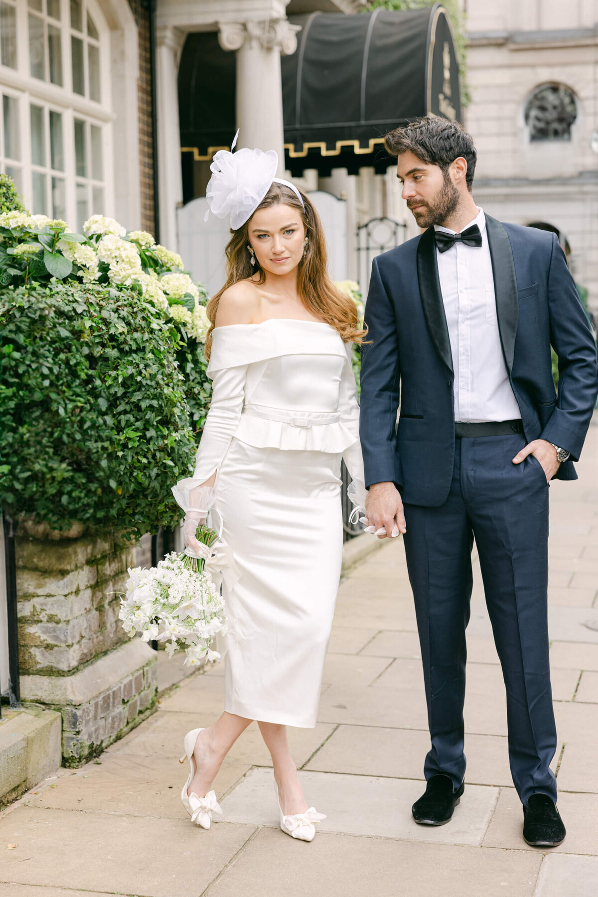 A wedding day photo of the couple in front of the Goring Hotel in London the United Kingdom