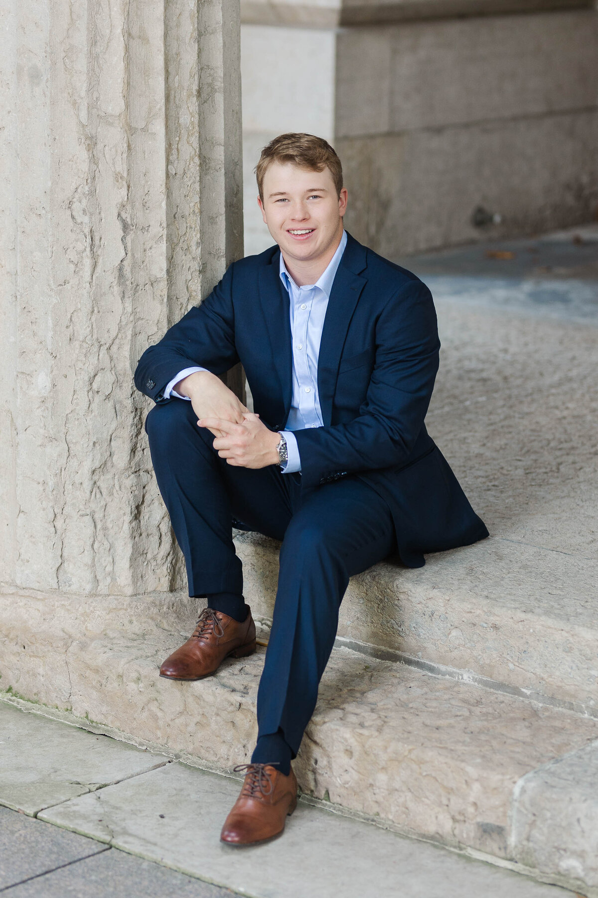 Senior guy portrait session in Columbus, Ohio, with a modern and downtown state house.