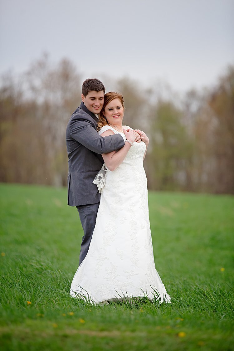 Bride and Groom prom pose portrait in sweeping field at White Barn in Prospect, PA