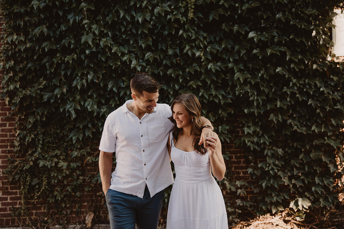 A person with their arm around their partner as they walk together 
