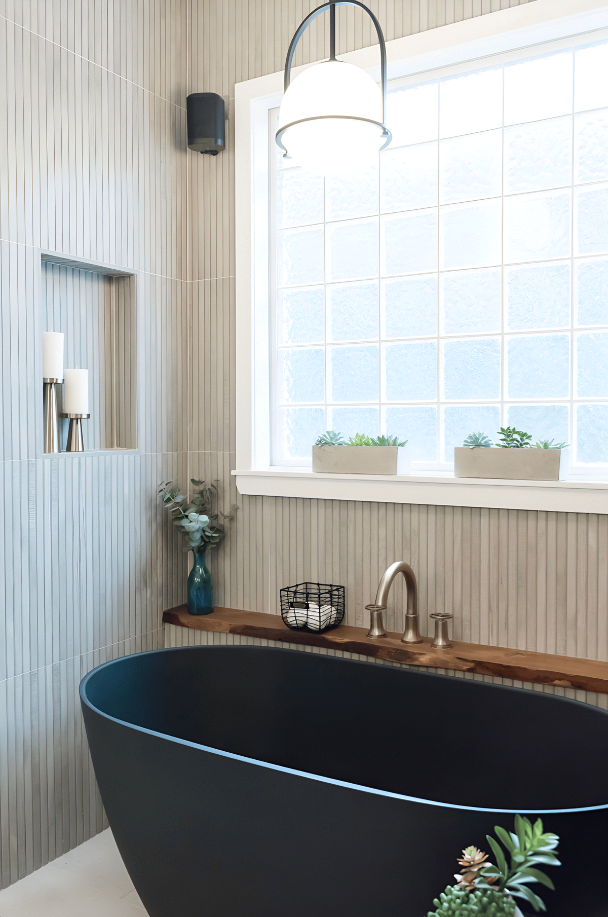 dewine design interiors hotel lux bathroom black standing tub with neutral color walls