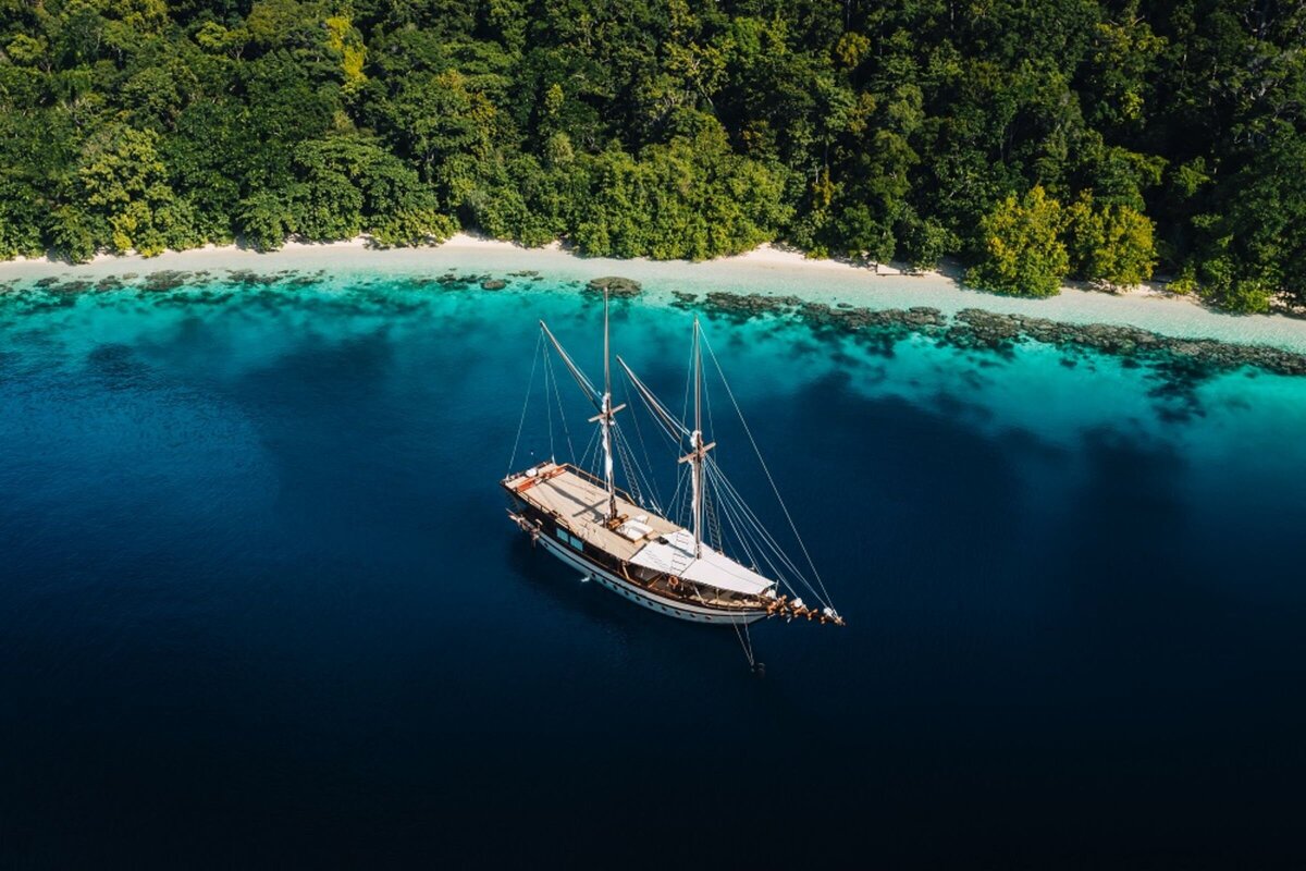 Senja Luxury Yacht Charter Indonesia _lowdef_anchoring_raja ampat_drone_landscape_1