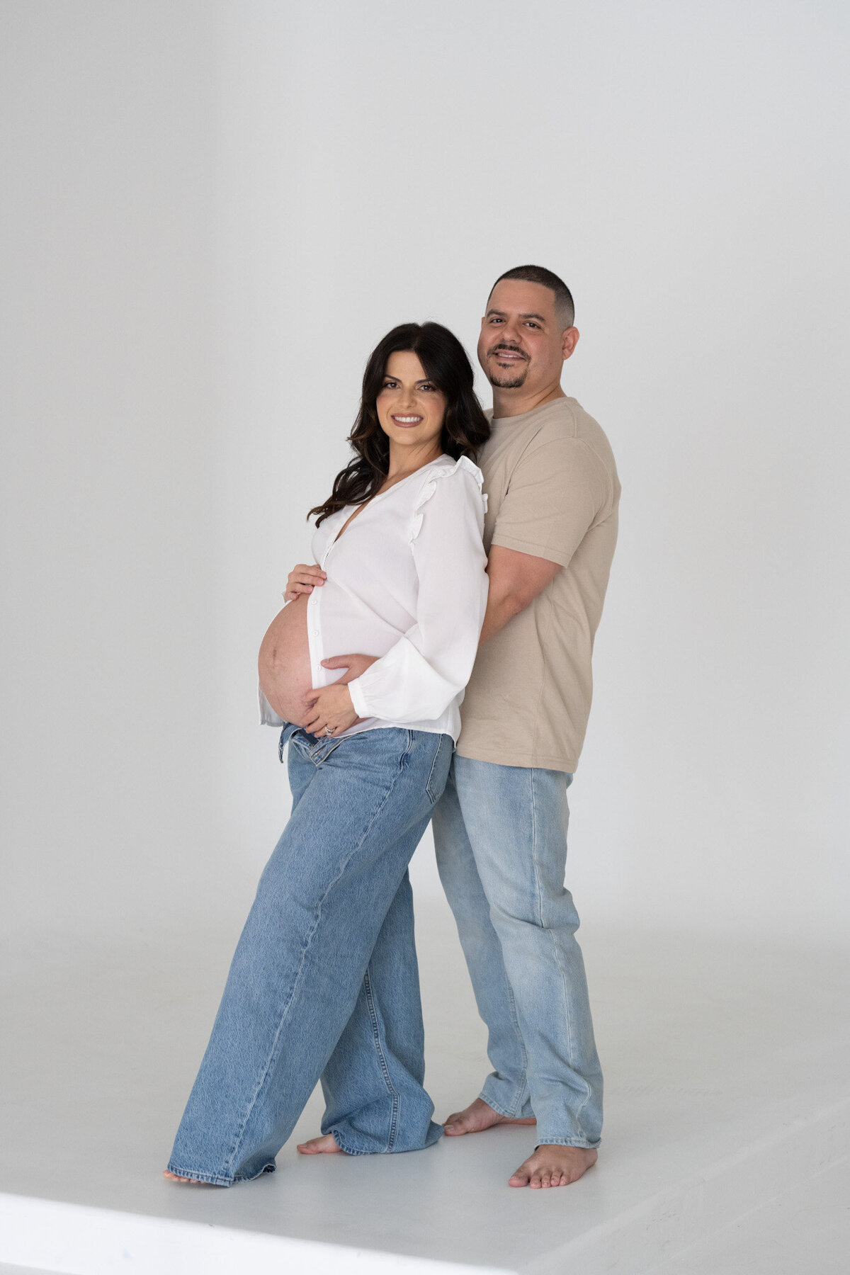 emmiclaire-maternity-partner-hug-from-behind-studio