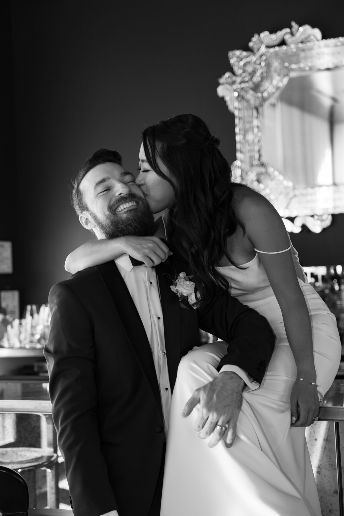 bride and groom take photo in the bar at their houston texas wedding venue