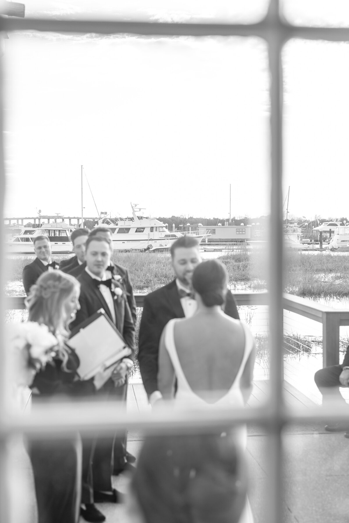 Bride and groom exchanging vows at a historic Charleston wedding venue