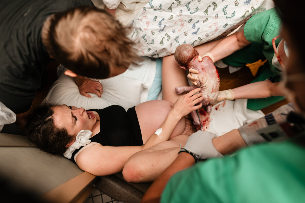 Twin birth mom having twins born in hospital unmedicated.