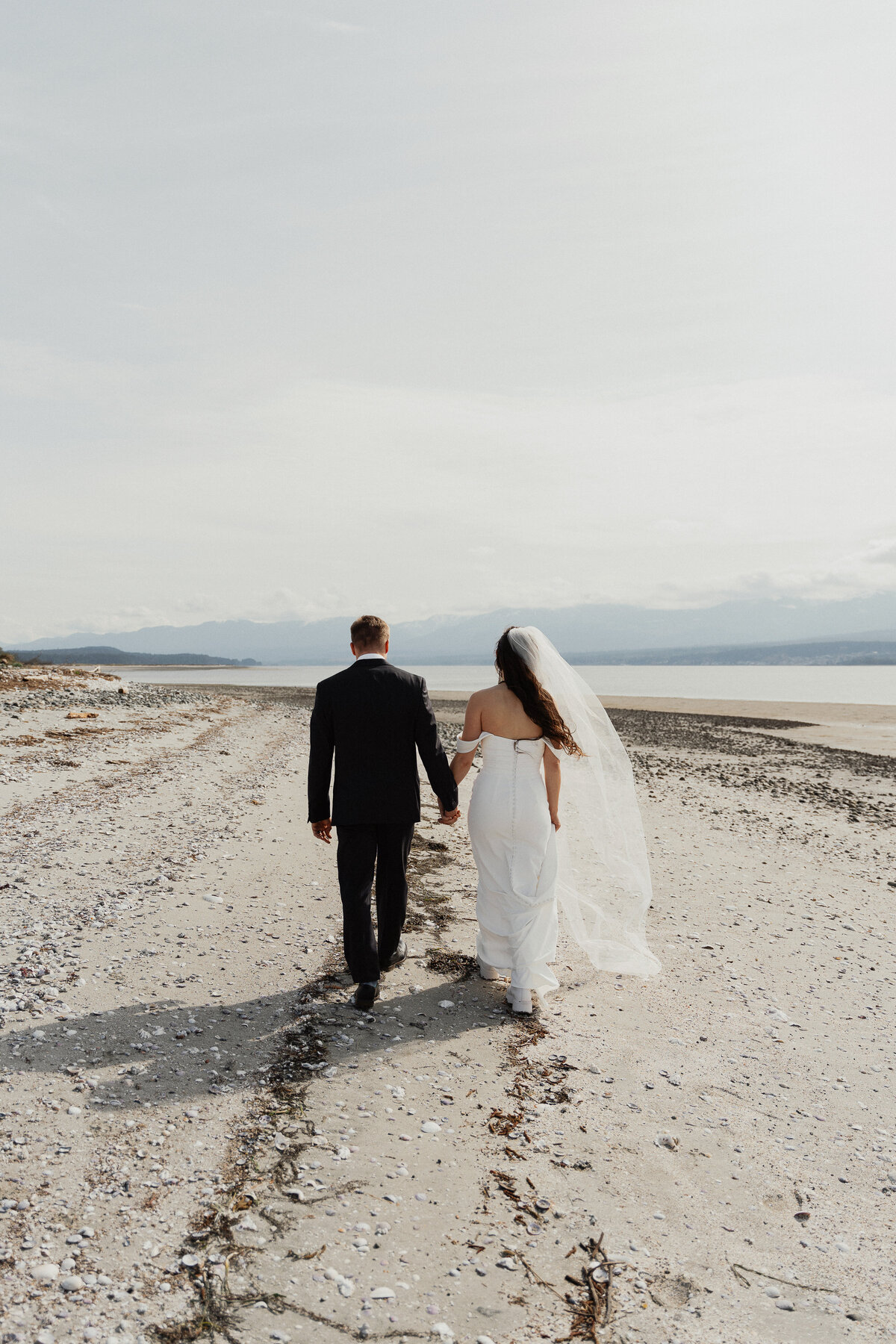 Bride and Groom during their sunrise helicopter and boat elopement in the Comox Valley by Latitude 49 Photography
