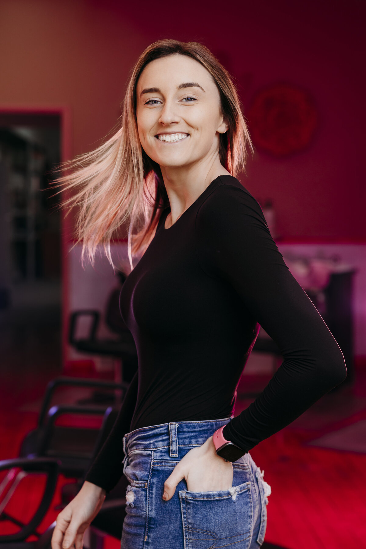 Studio 57 Salon owner doing a hairflip pose. 