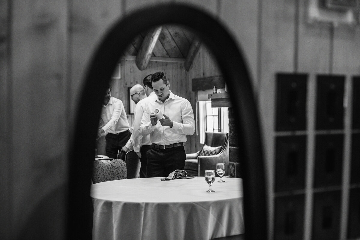 black and white groom getting ready picture
