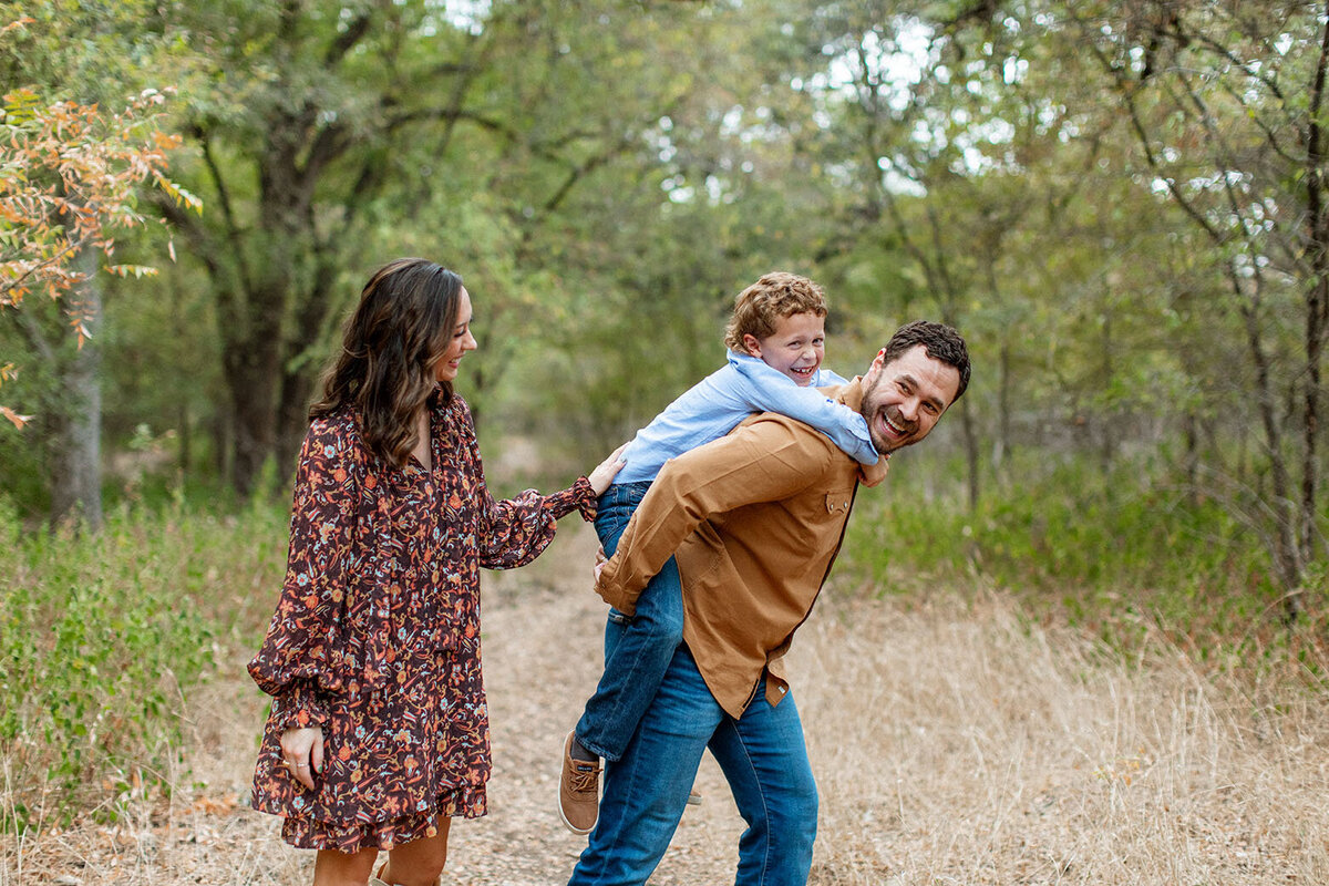 Outdoor family photography session in natural setting - Sara James San Antonio photographer specializes in creating beautiful family portraits in scenic Texas outdoor environments and nature locations
