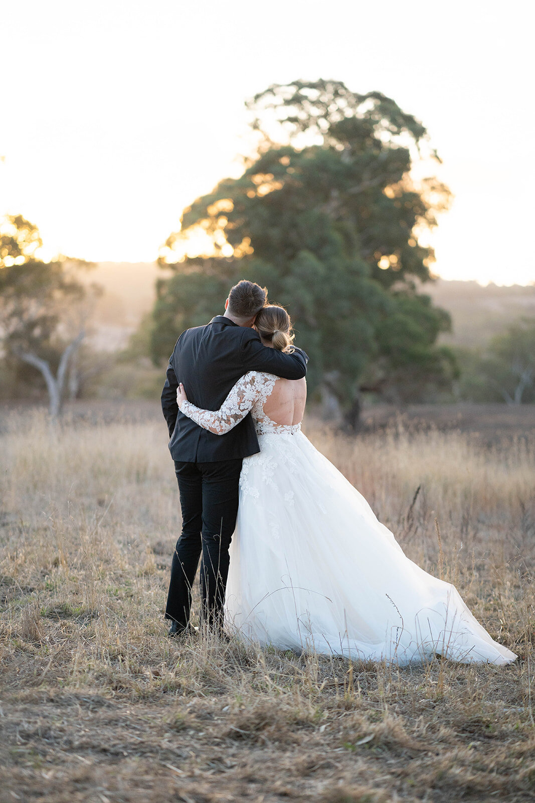 bride and groom at sunset
