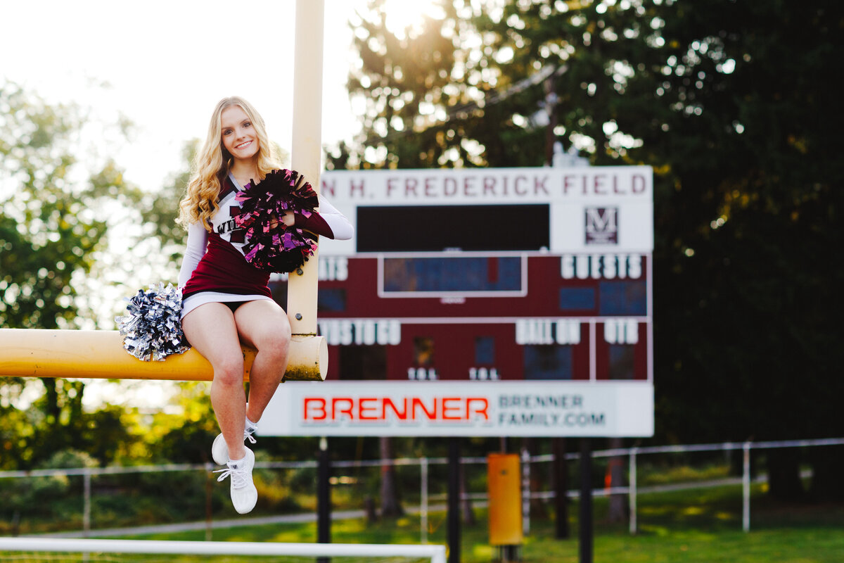 Mechanicsburg-Senior-Photos-Cheerleader-Football-field-Unique-sports-portraits