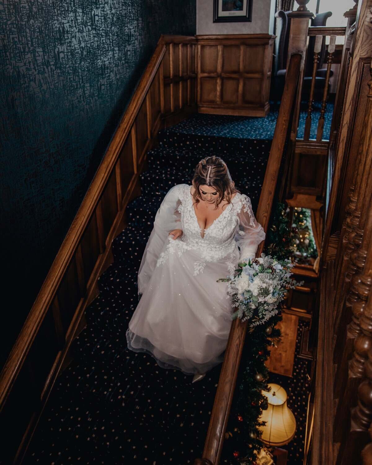 Bride walking down stairs at Moat House Wedding
