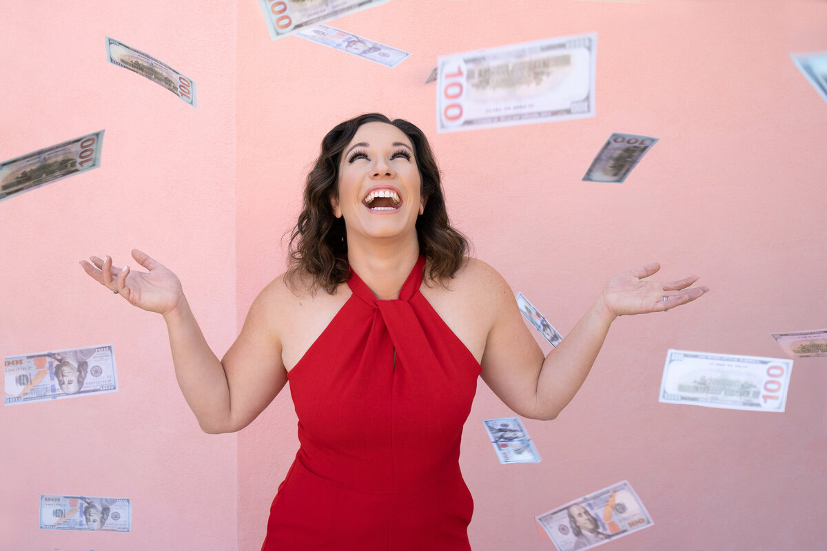 money-falling-from-sky-on-woman-in-red