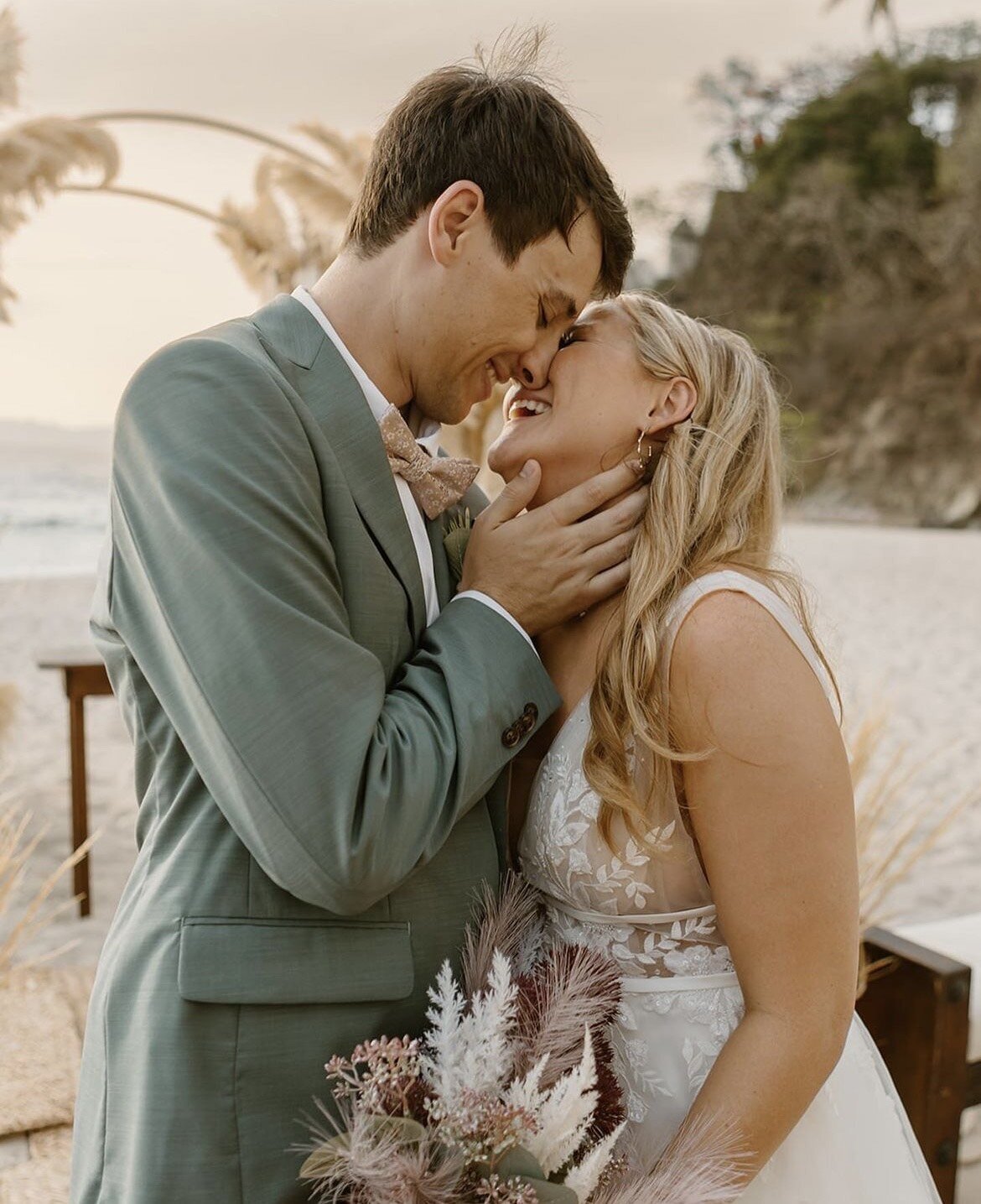 Bride and groom share a tender moment after their destination wedding, with the bride styled by a mobile bridal hair and makeup artist near me.