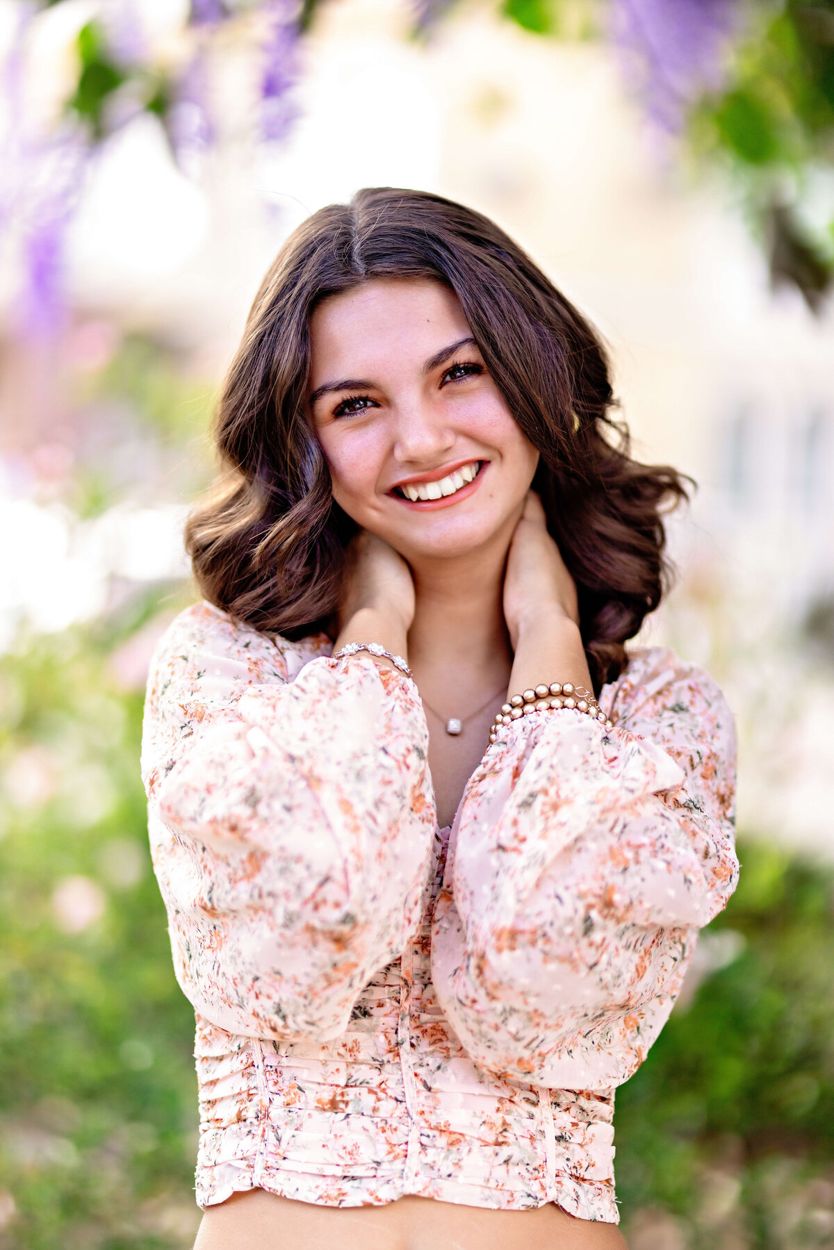 Playful senior portrait with soft florals and pastel tones in Central Florida