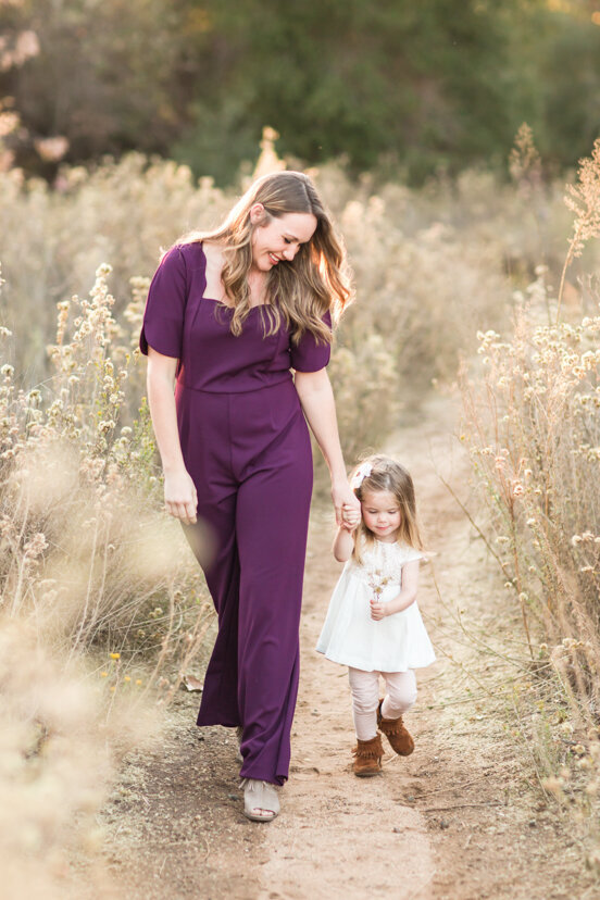 mother-and-daughter-walking-in-field--sweetwater-river-bridge-san-diego