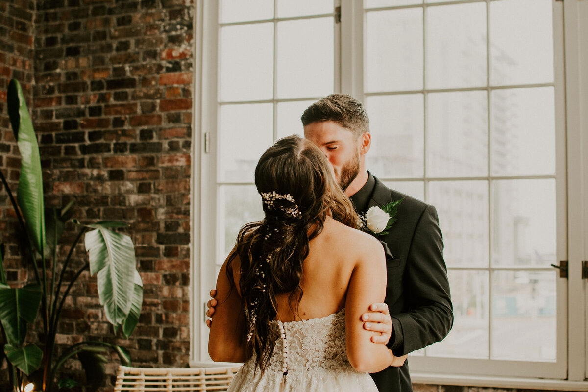 back of bride's hair kiss