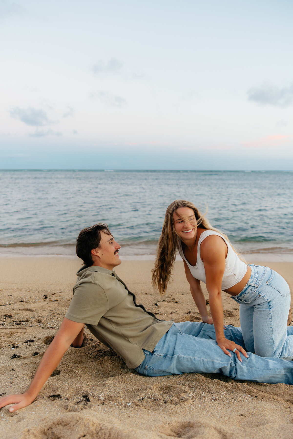 Romantic, dreamy, true-to-color couples session surrounded by pastel skies and the ocean in Honolulu, Hawaii