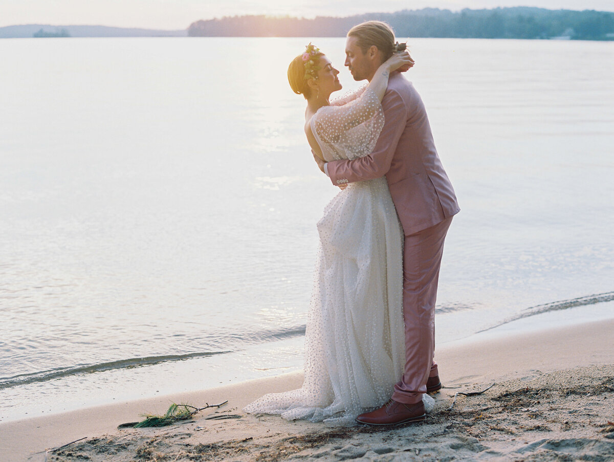 bride and groom sunset photo at Lake Winnipesaukee wedding