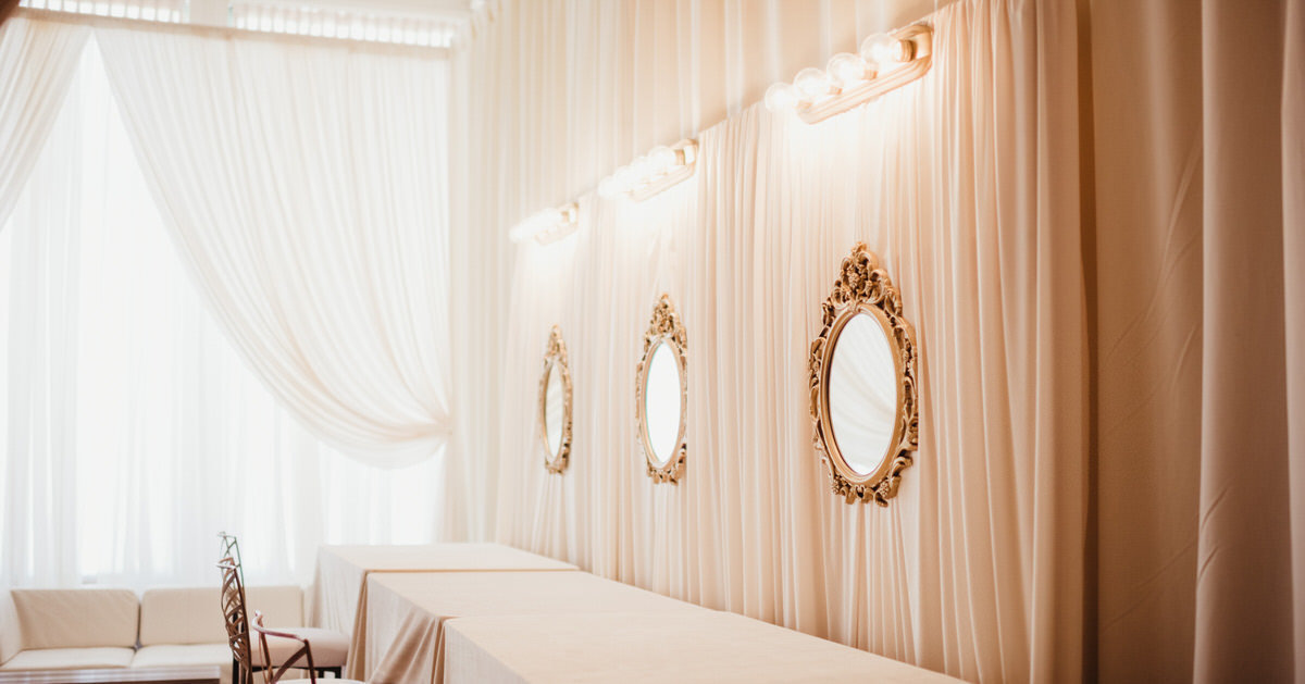 gold mirrors, draped getting ready room, lounge furniture