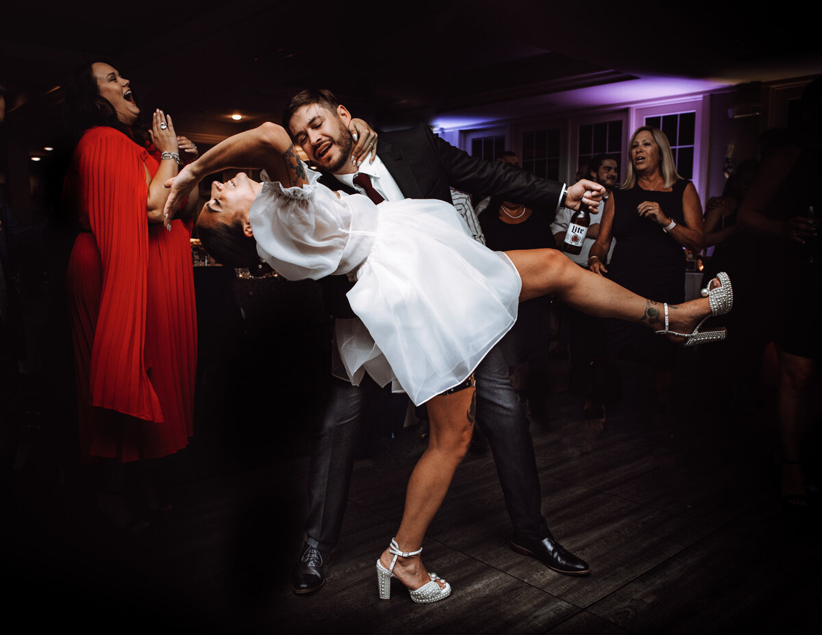 A sample image from Philadelphia wedding photographer Daring Romantics. A couple dances.