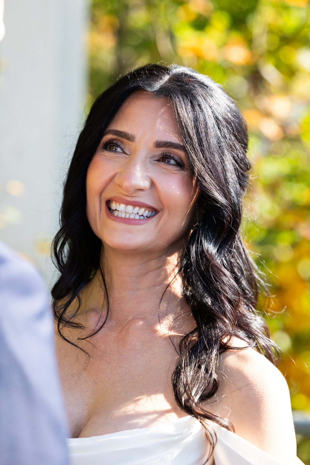 bride smiles during her wedding vows