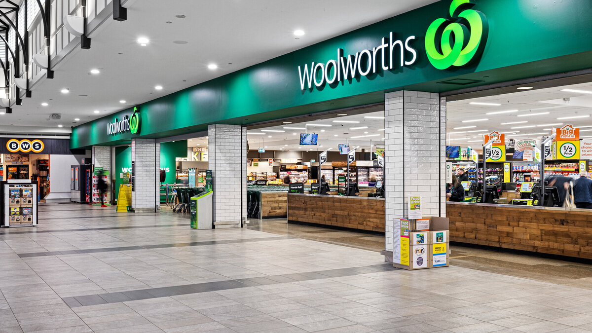 Exterior view of Woolworths supermarket entrance at Bendigo Marketplace, showcasing a clean, modern storefront with bright signage and open interior layout.