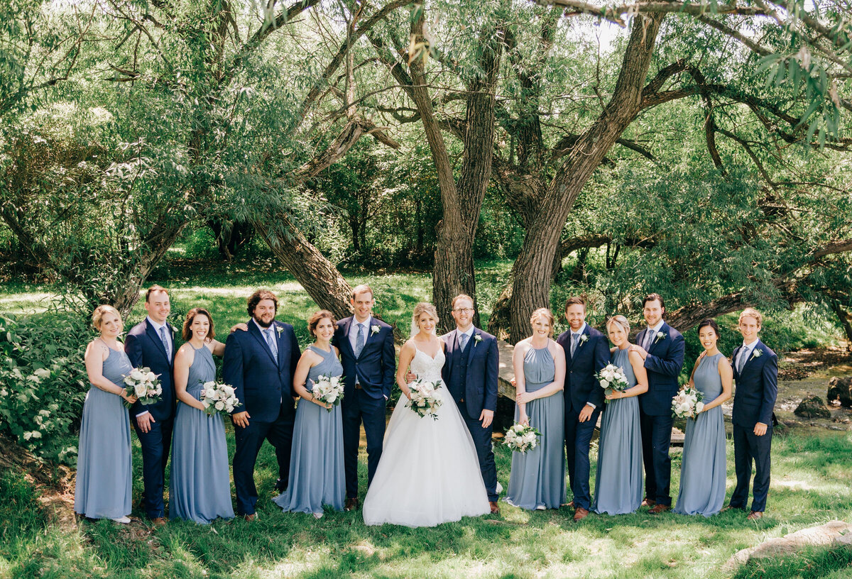 Blue themed wedding party portraits photographed by Nova Markina