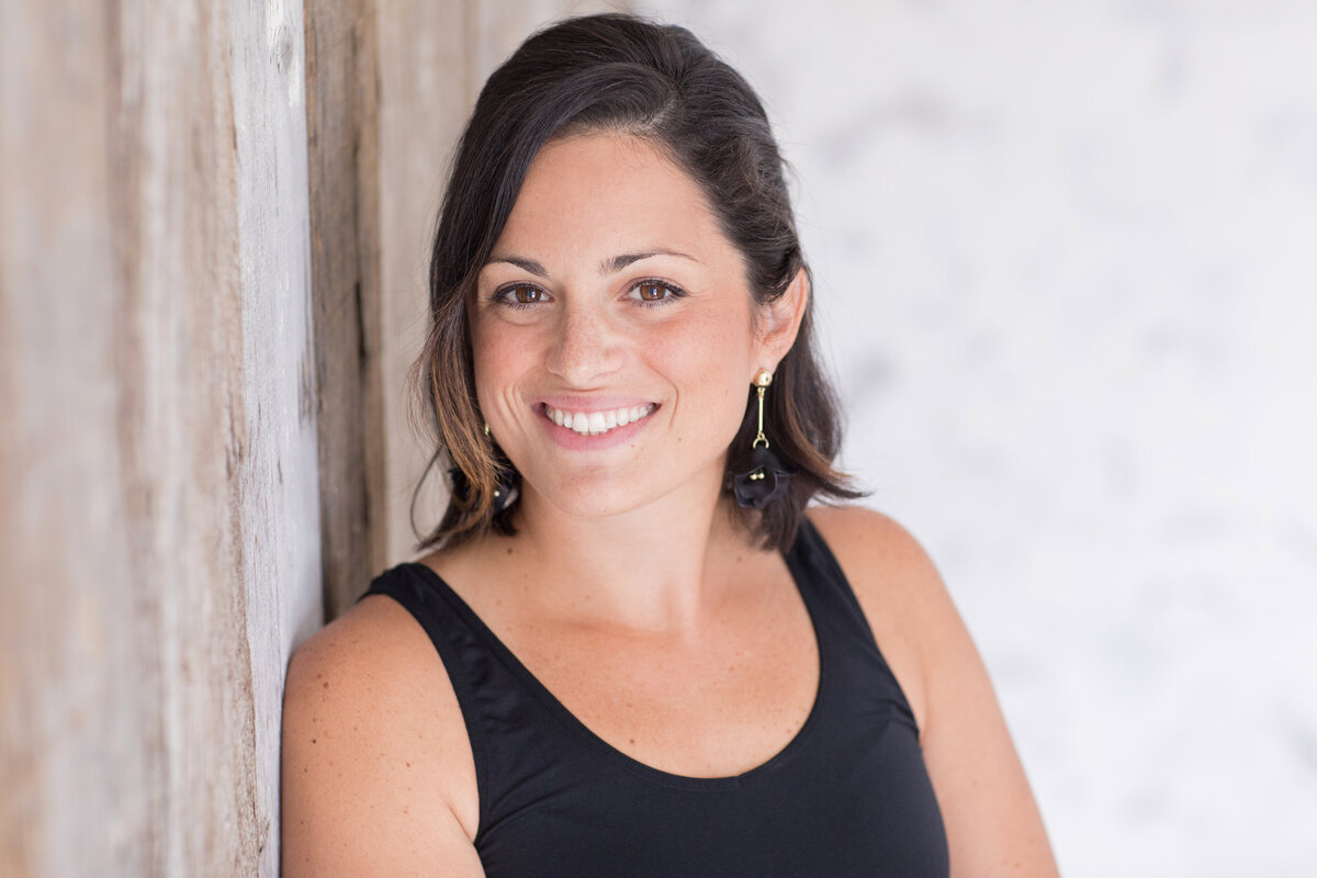 Professional portrait of woman in dark top