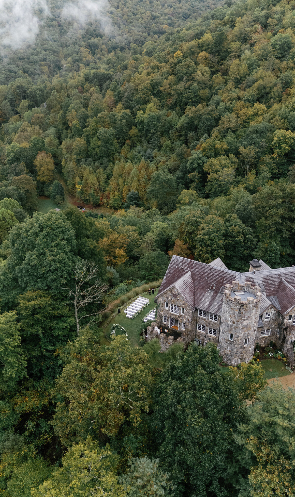 Aerial view of Castle Ladyhawke and the ceremony lawn nestled in the North Carolina mountains during fall.
