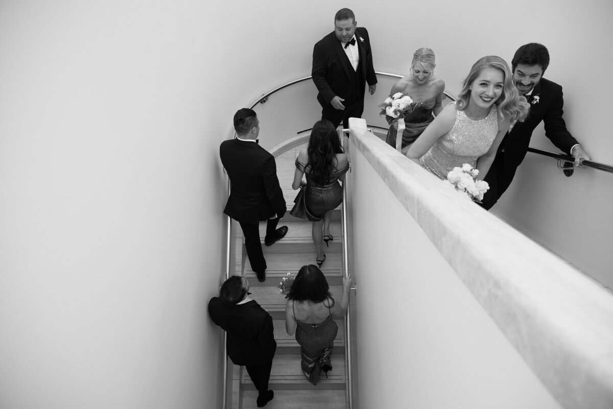 wedding party walking up stairs