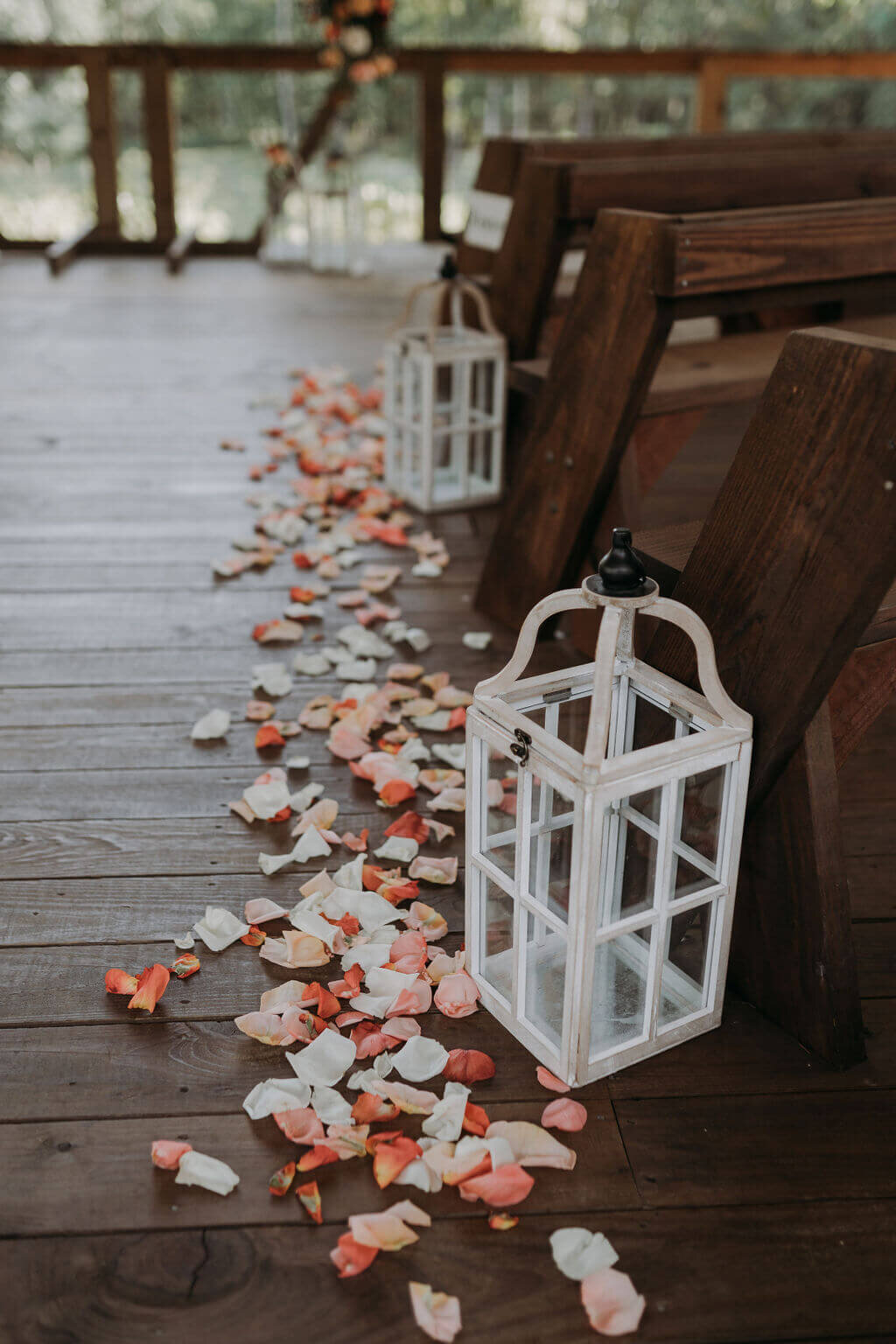 Wedding ceremony lanterns and rose petals