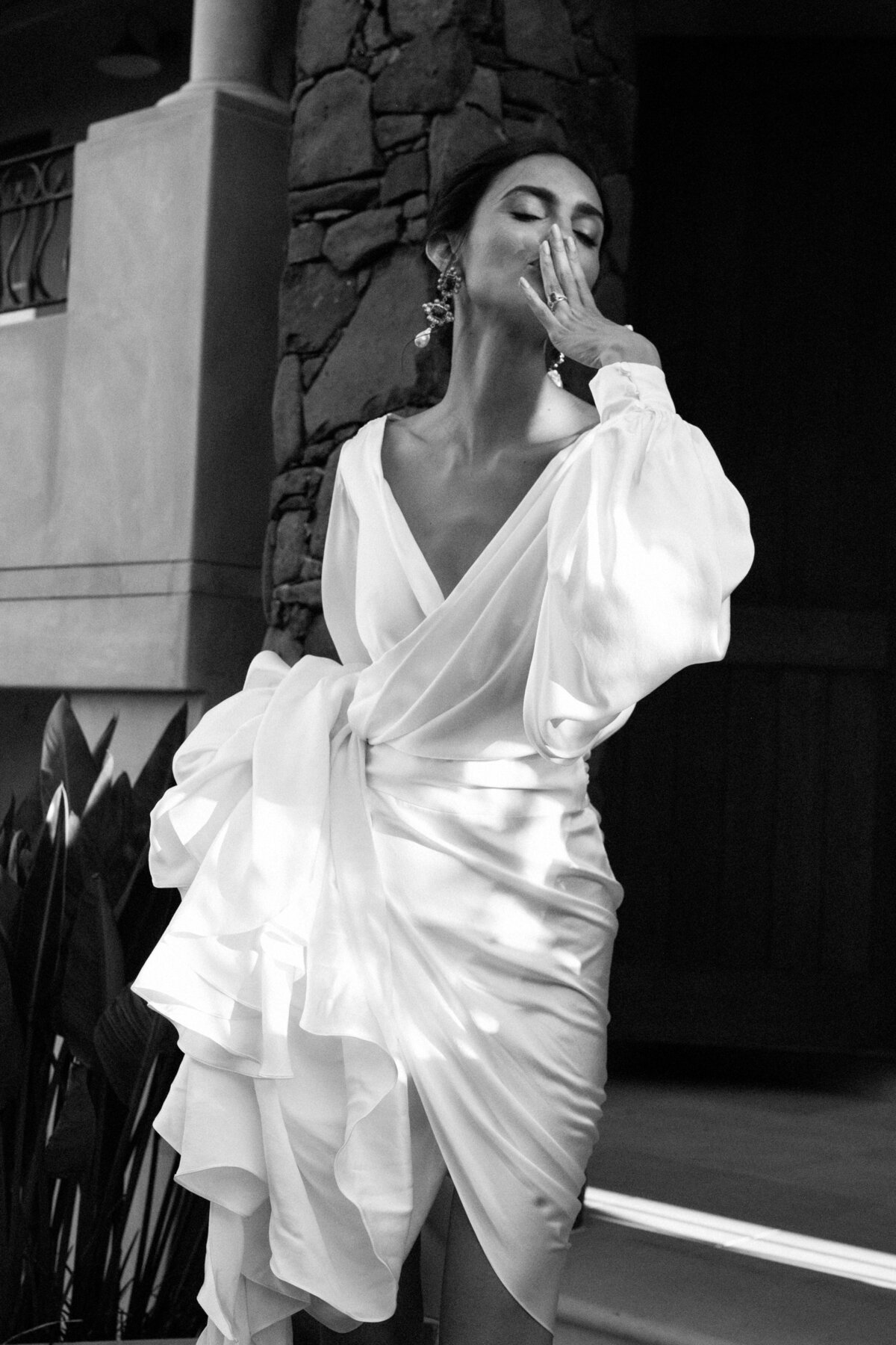 Silk wedding gown, modern british bridal designer, bride holding up to show ruffles